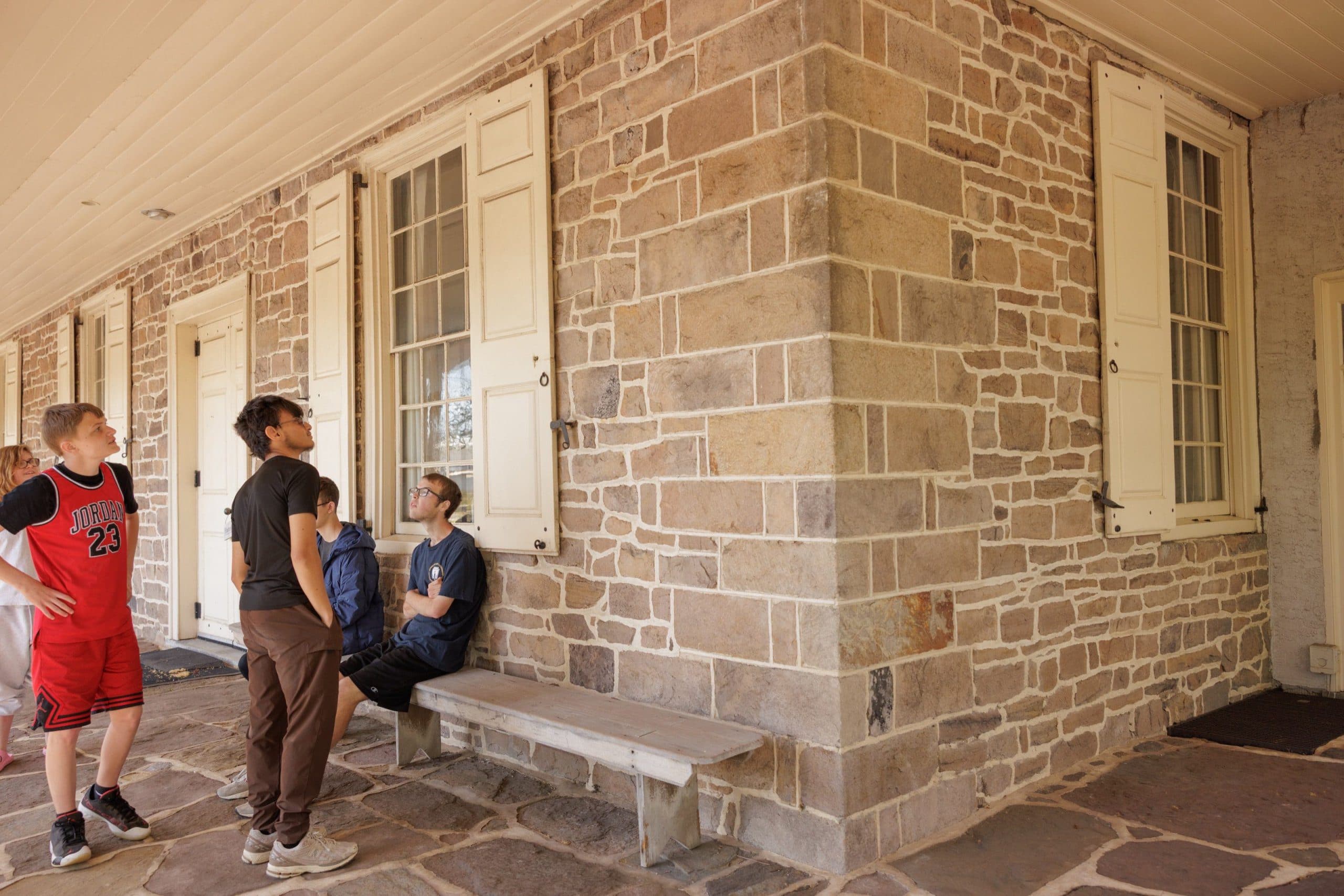 Students sitting outside a campus building