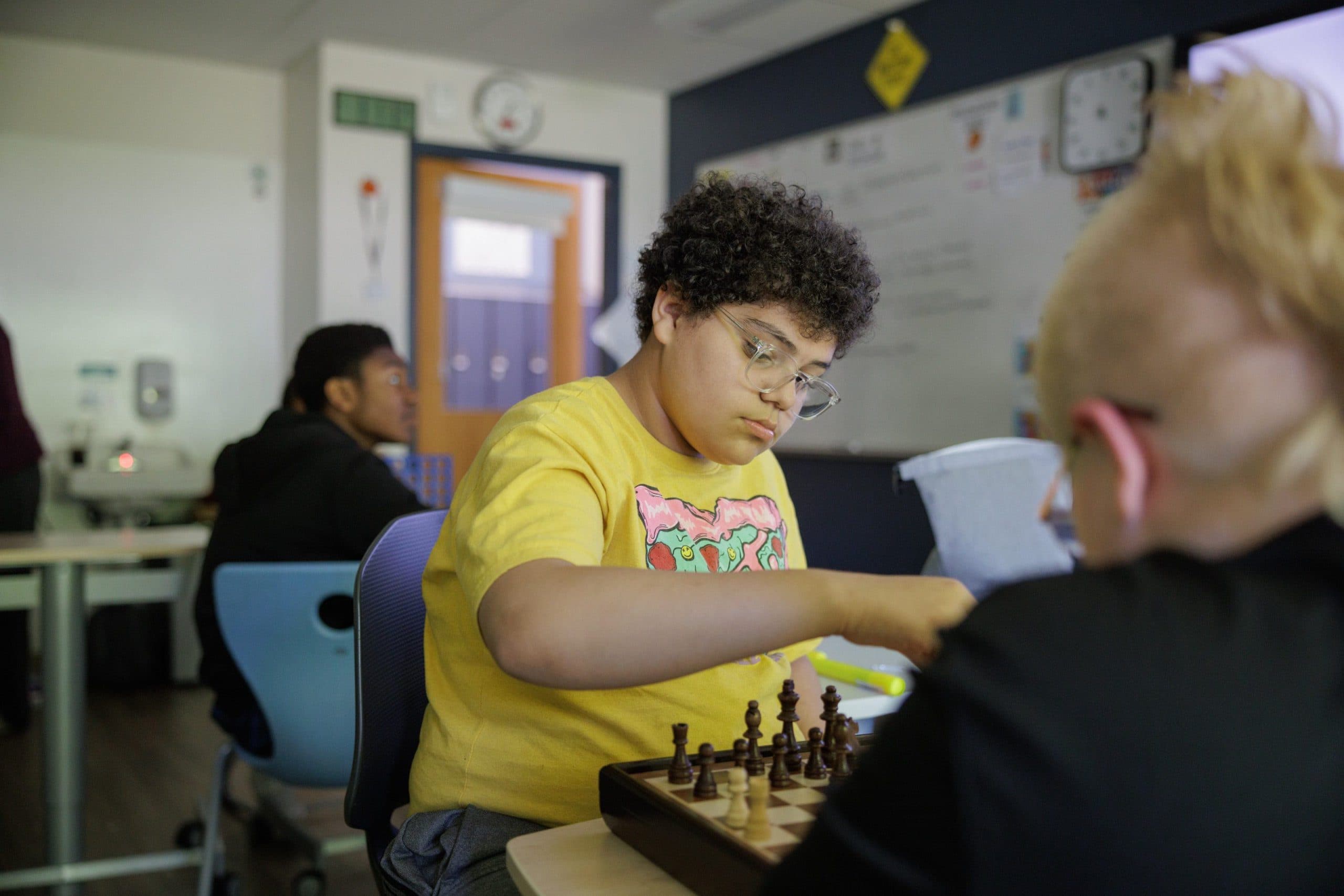 Students playing chess