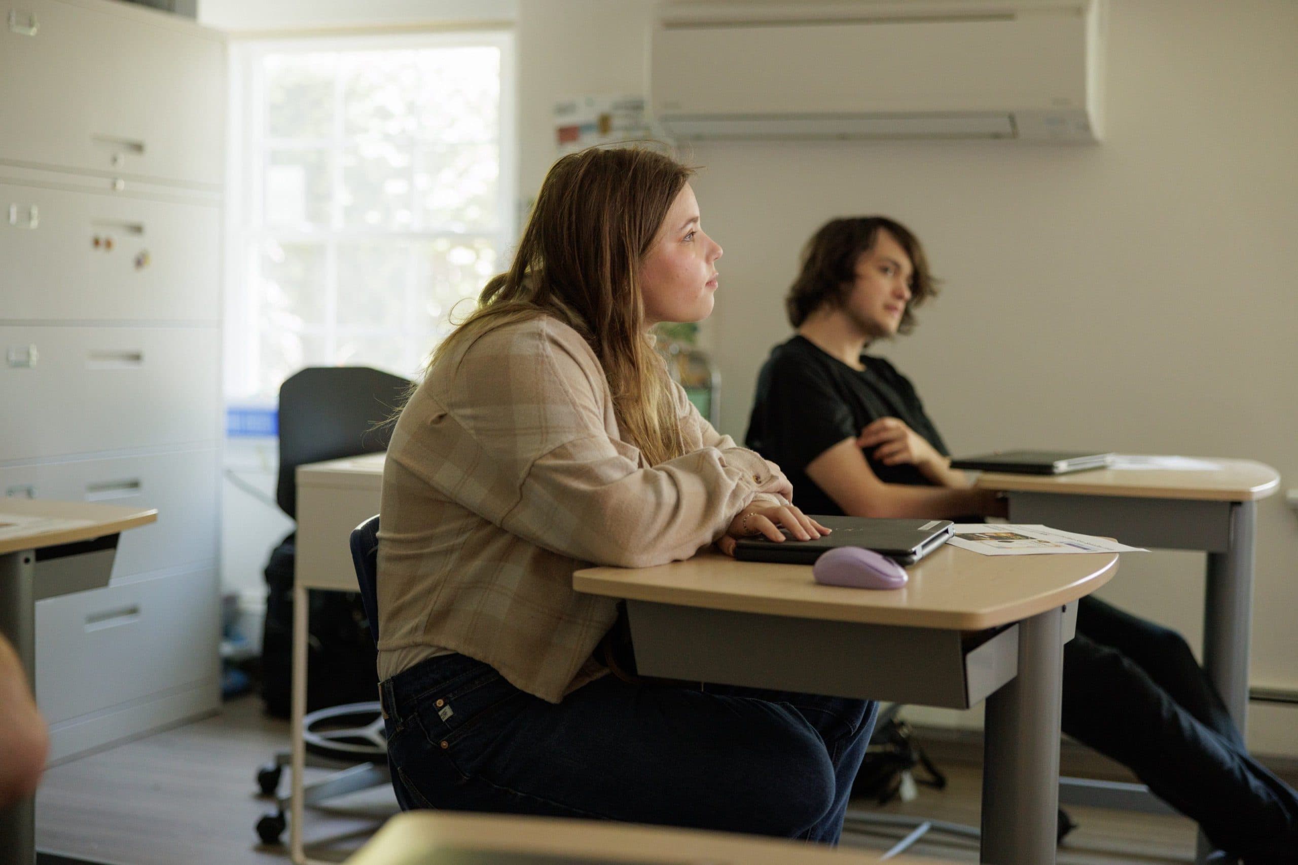 Students listening in a classroom