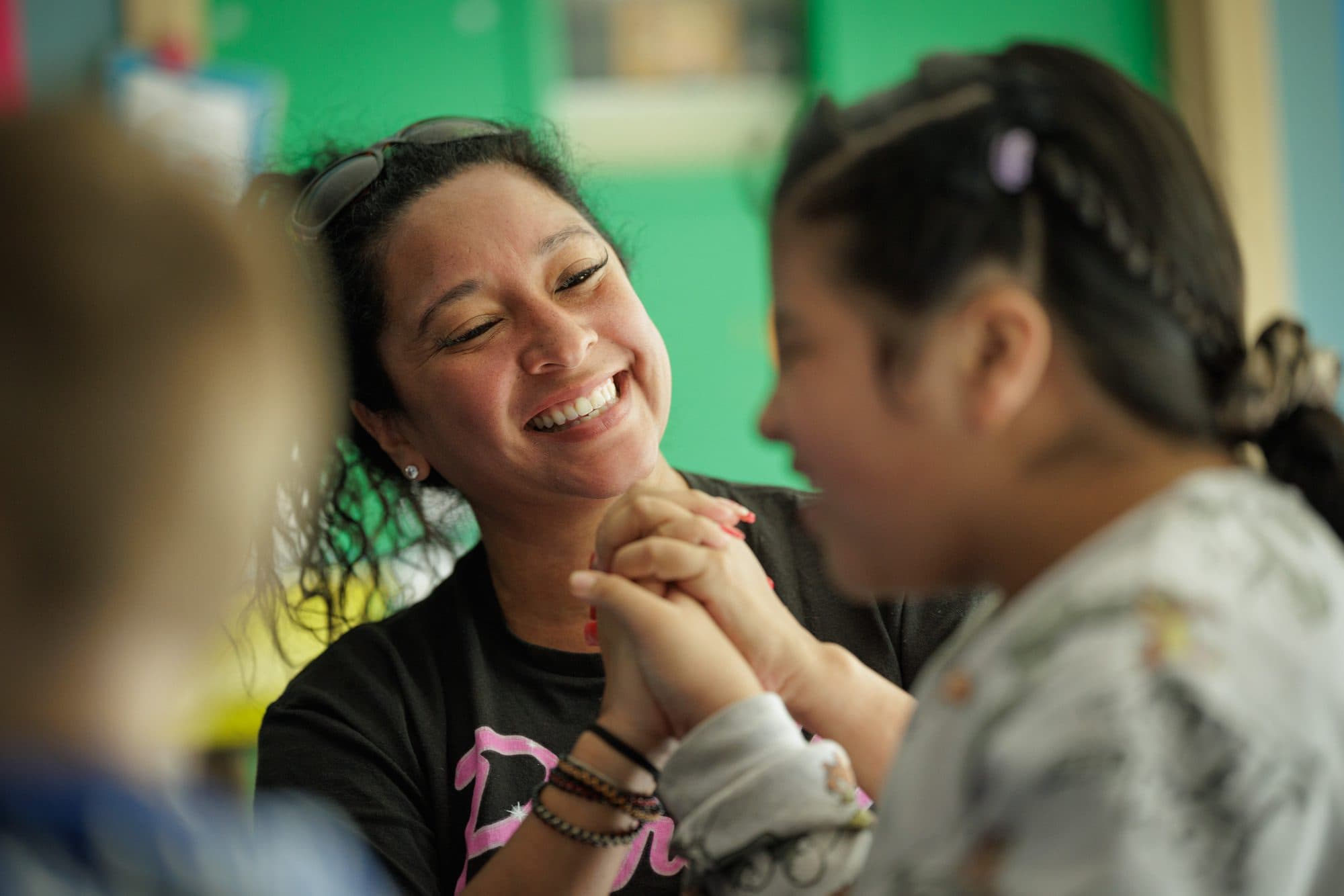 Teacher clapping with students