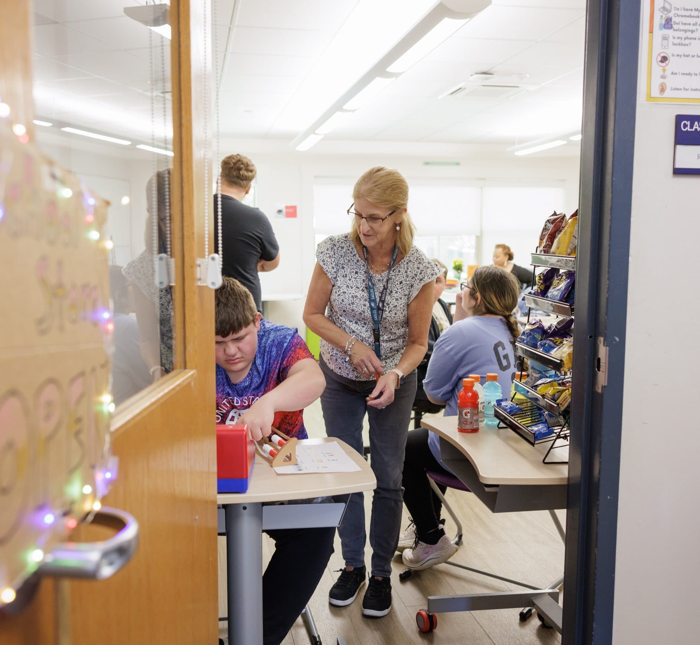 teacher and student working together in a classroom