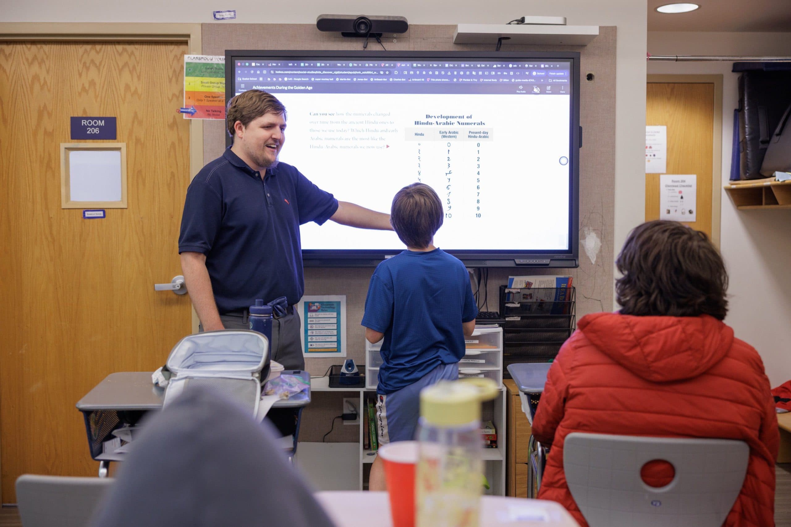 Teacher and a student at a whiteboard