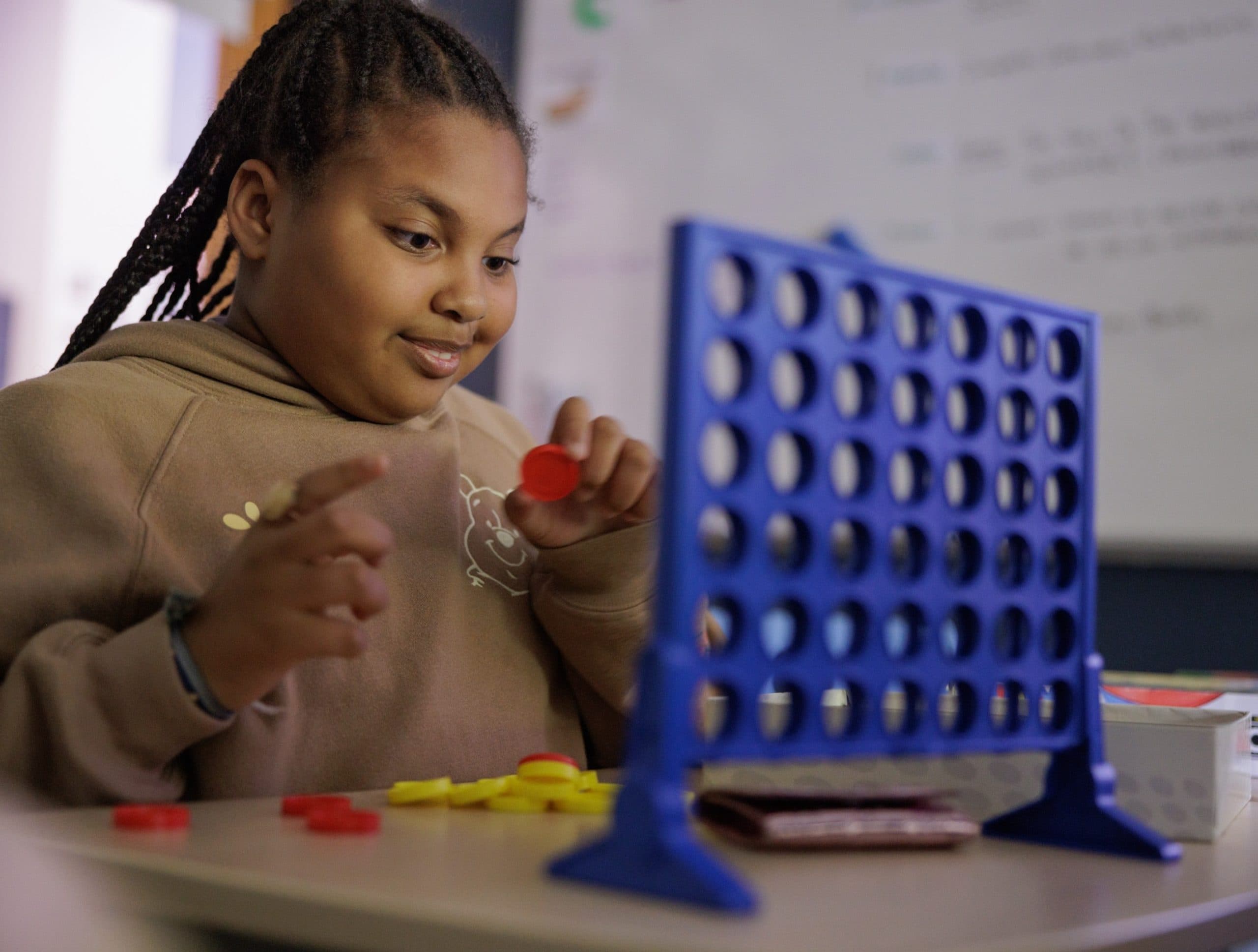 Student playing Connect Four