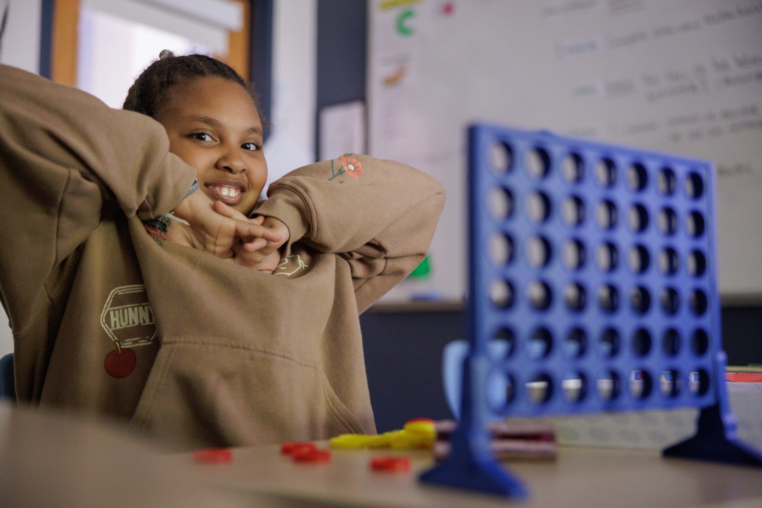 Student playing Connect Four