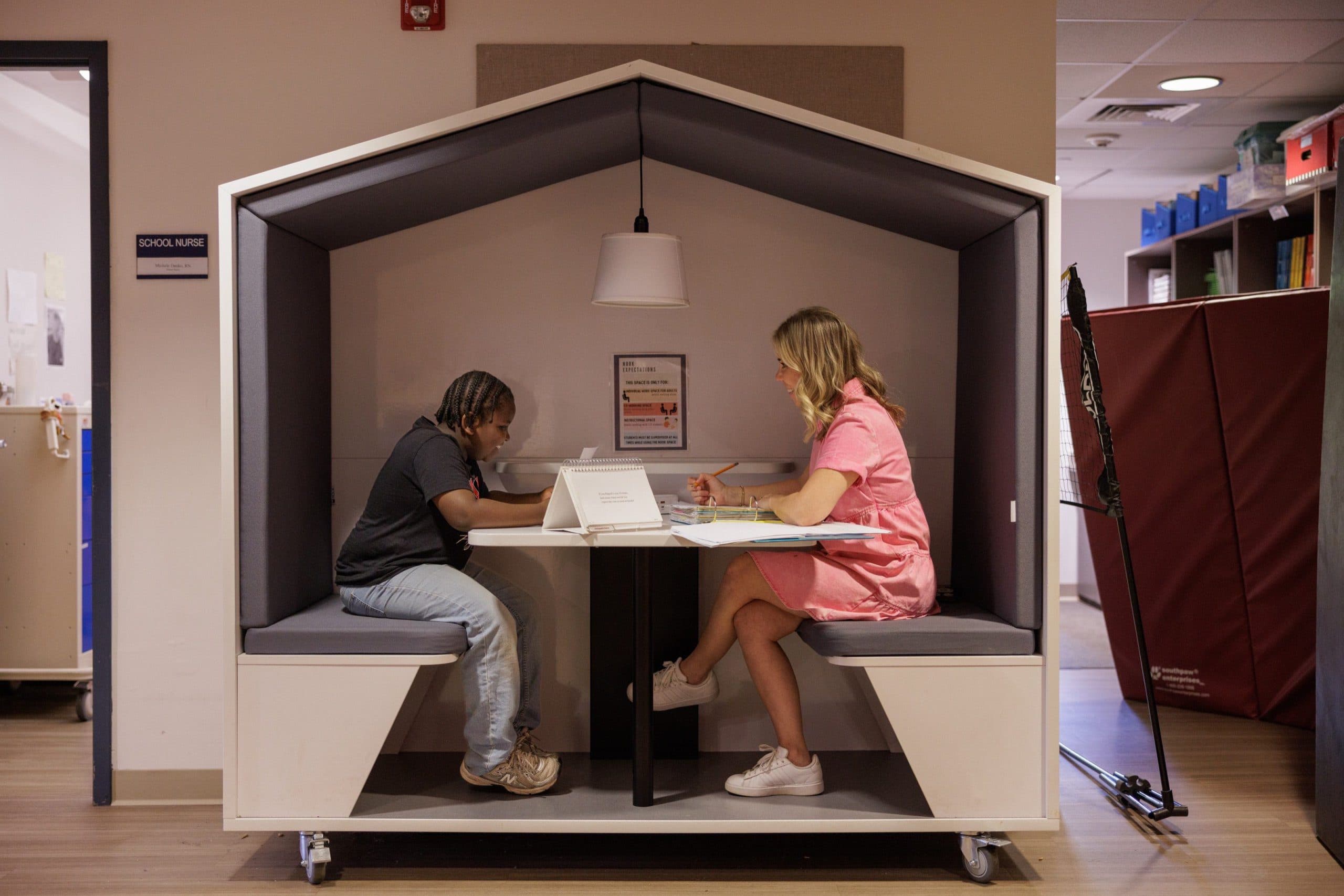 Teacher tutoring a student