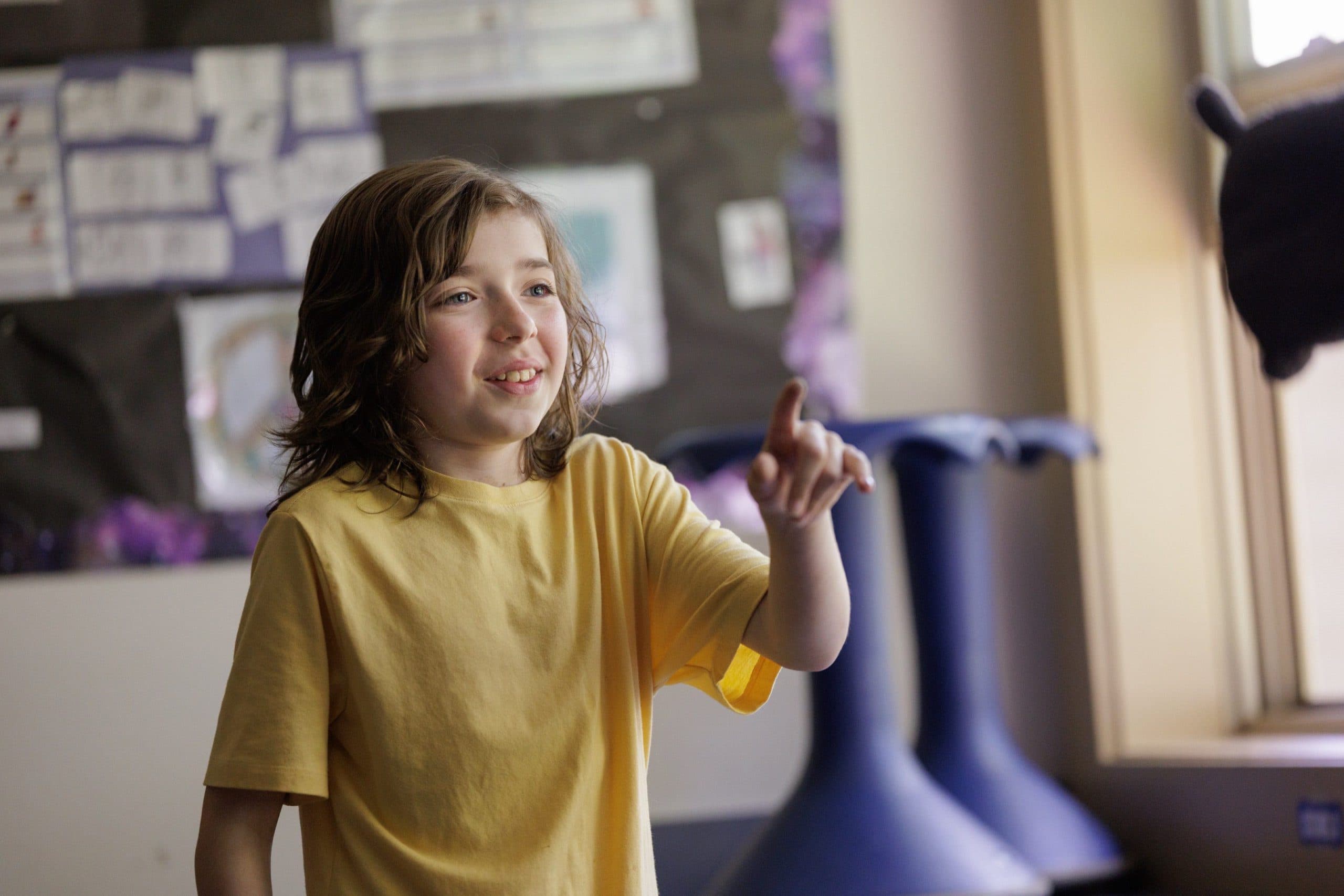 Student pointing during a classroom activity