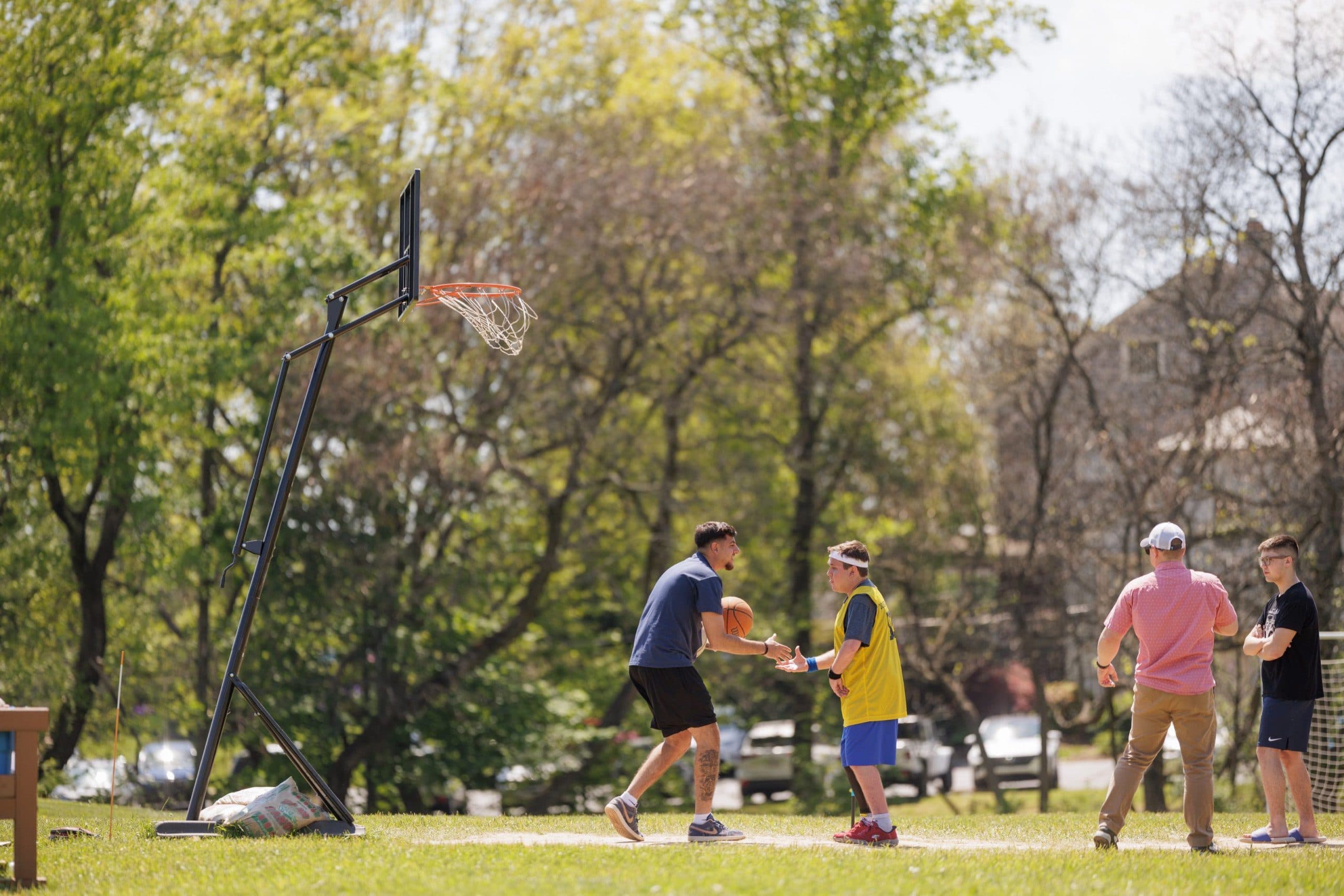 Student playing with a ball outdoors