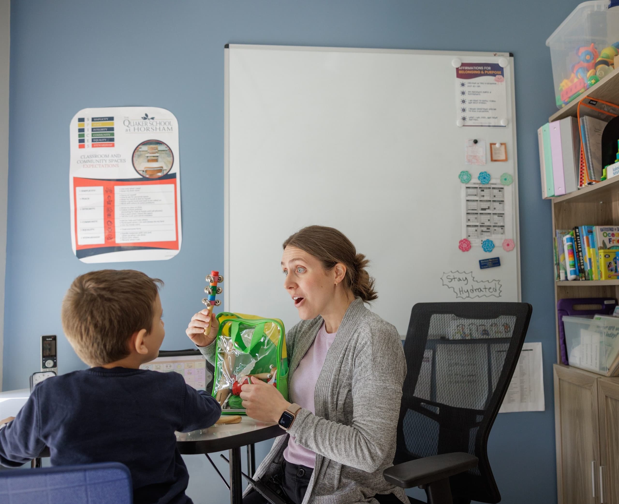 Speech therapist working with a young student