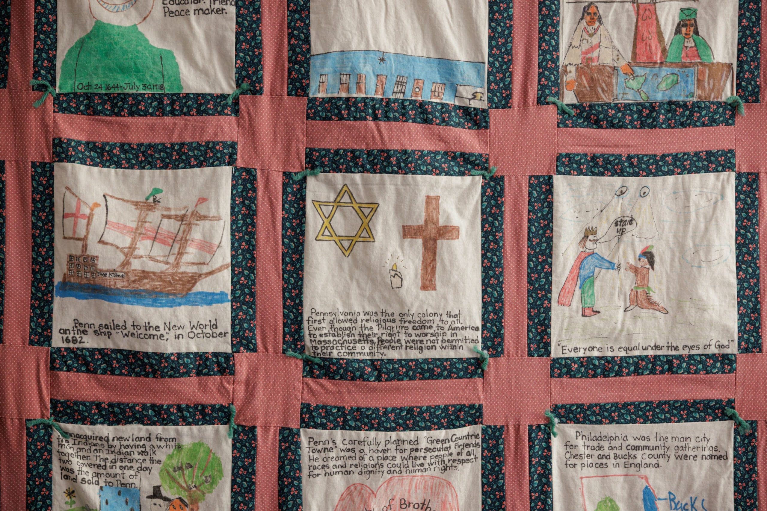Student-made quilt panel with interfaith symbols