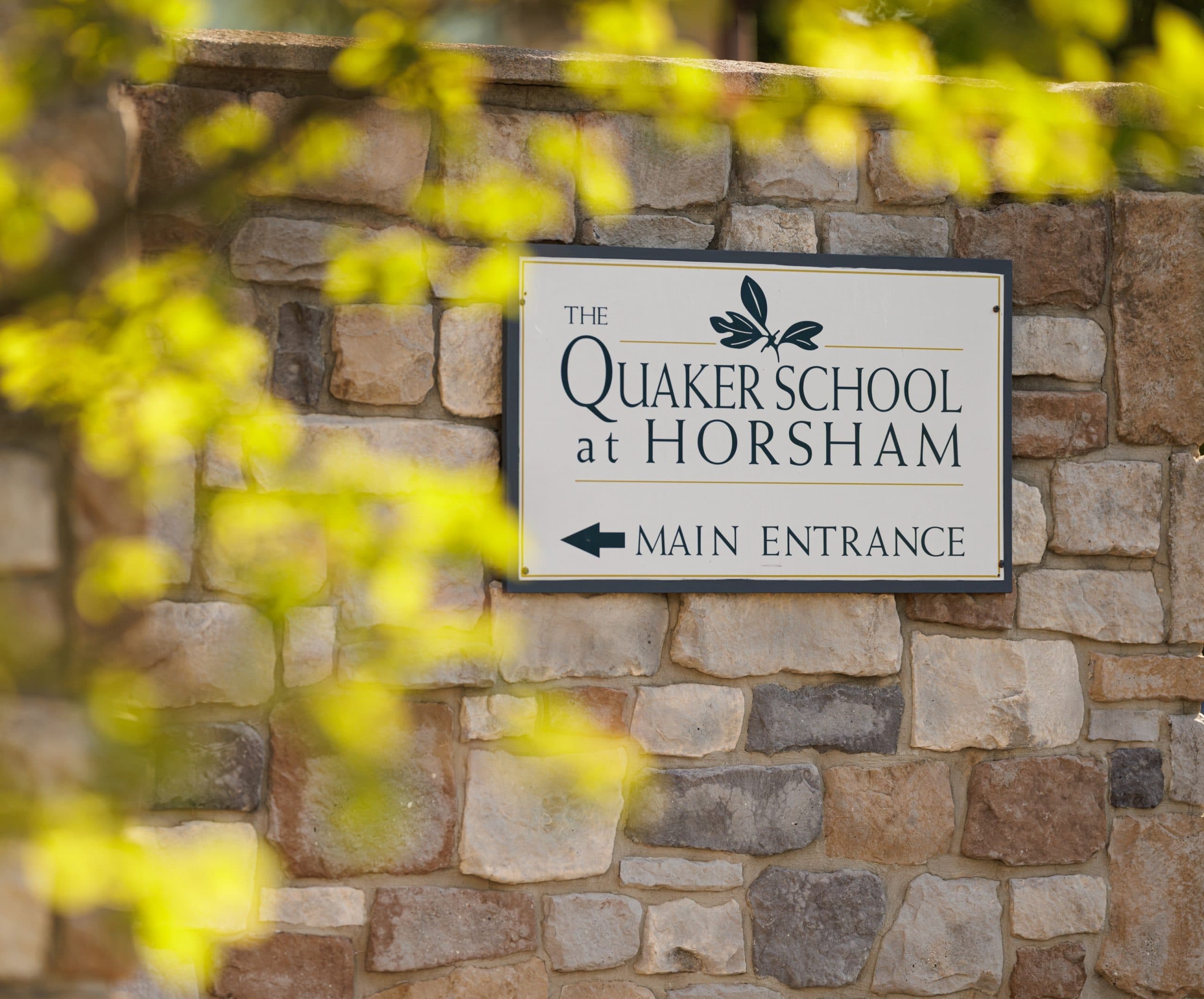 Sign directing visitors to the Main Entrance of The Quaker School at Horsham