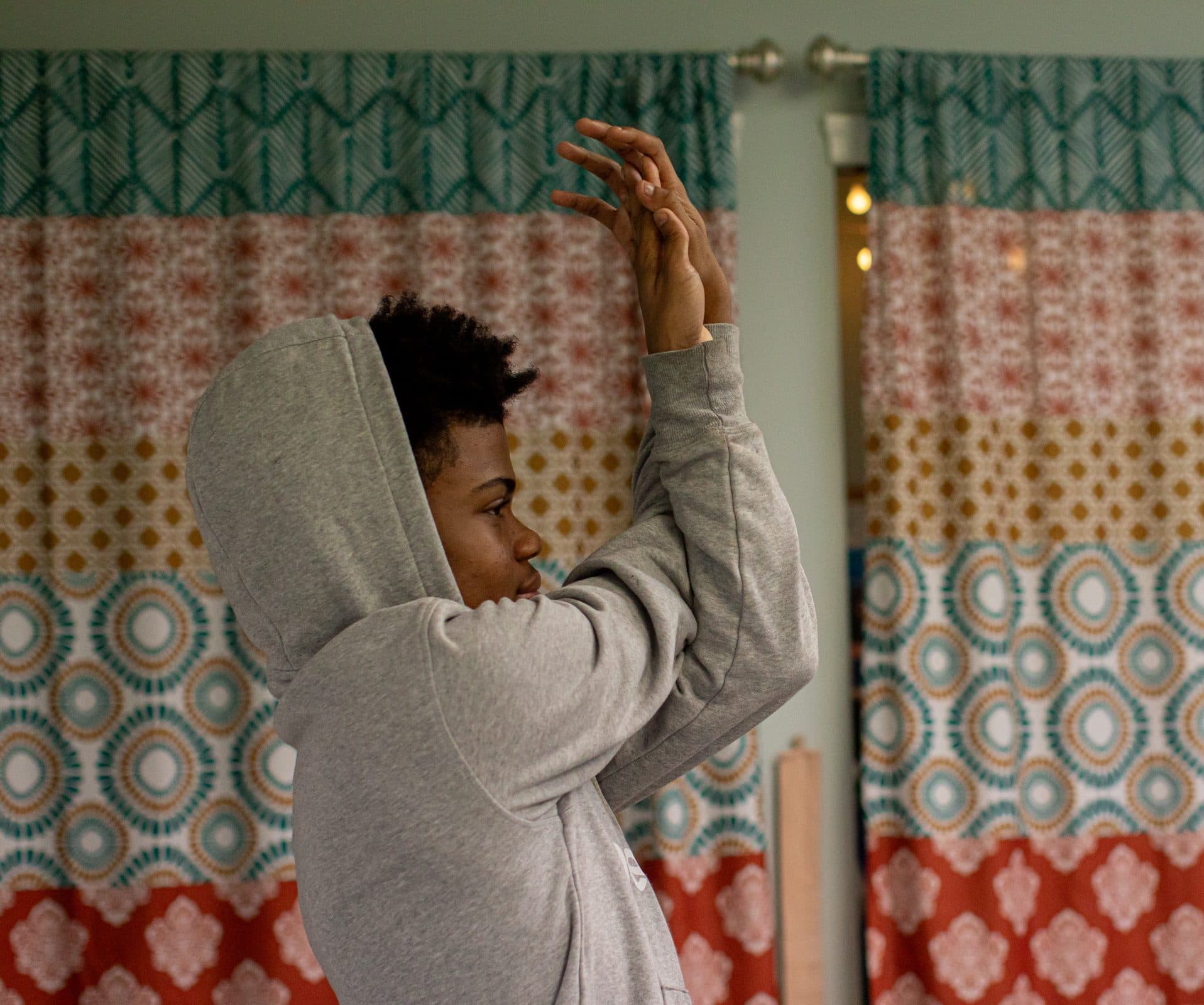 Student reaching up during a stretching exercise