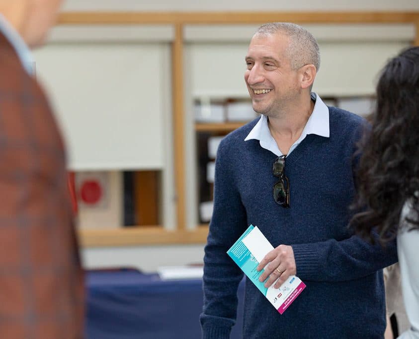 Staff member member smiling during a meeting
