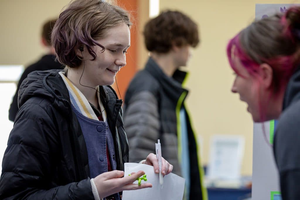 Smiling student wearing earphones