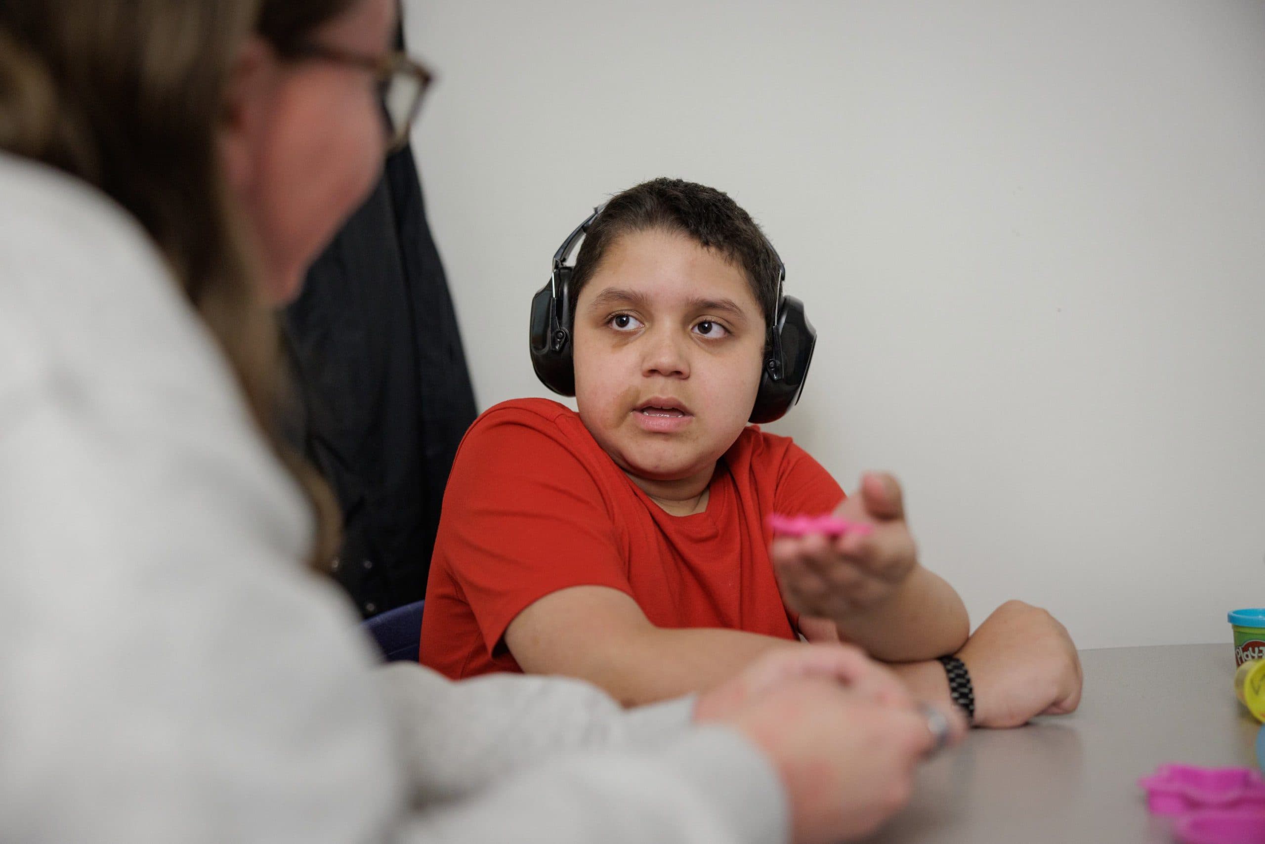 Student wearing noise-reducing headphones