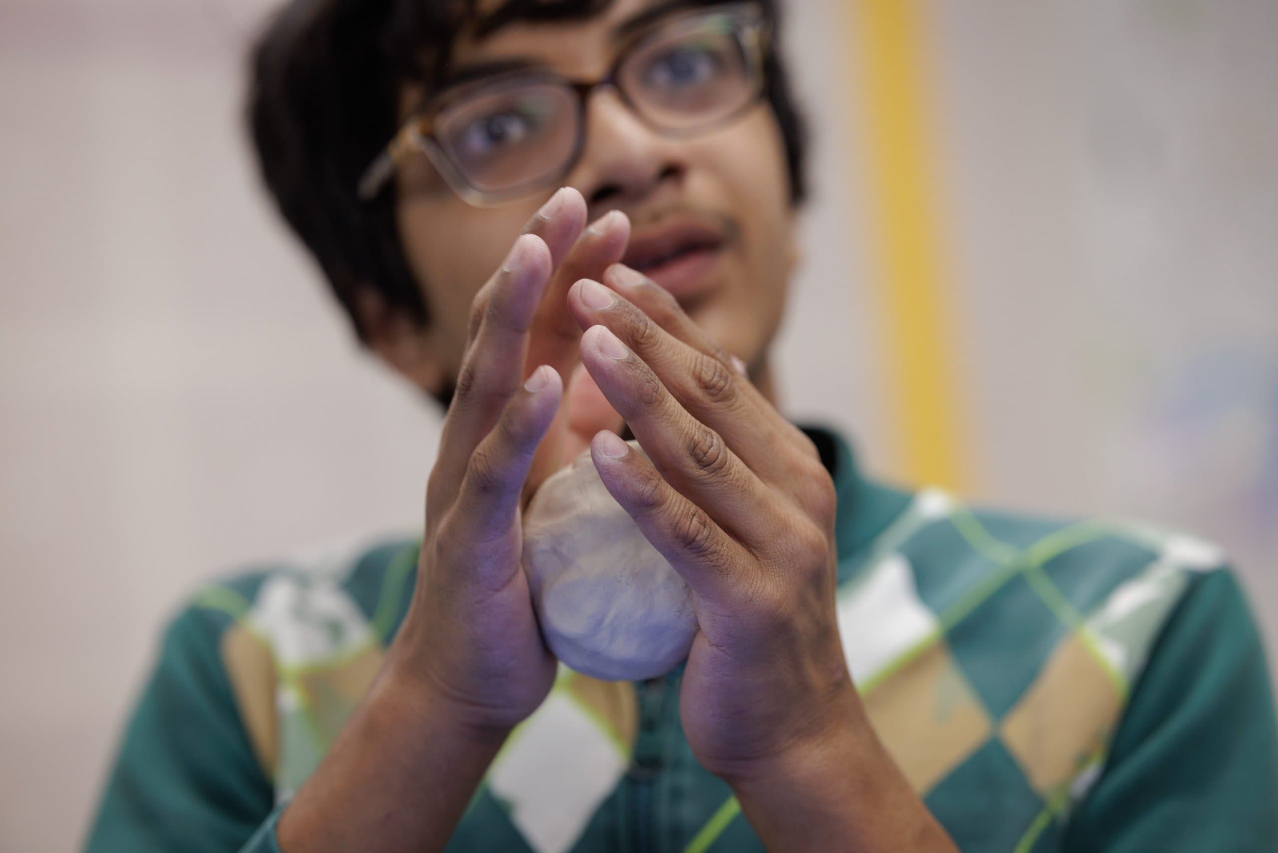 Student working with clay
