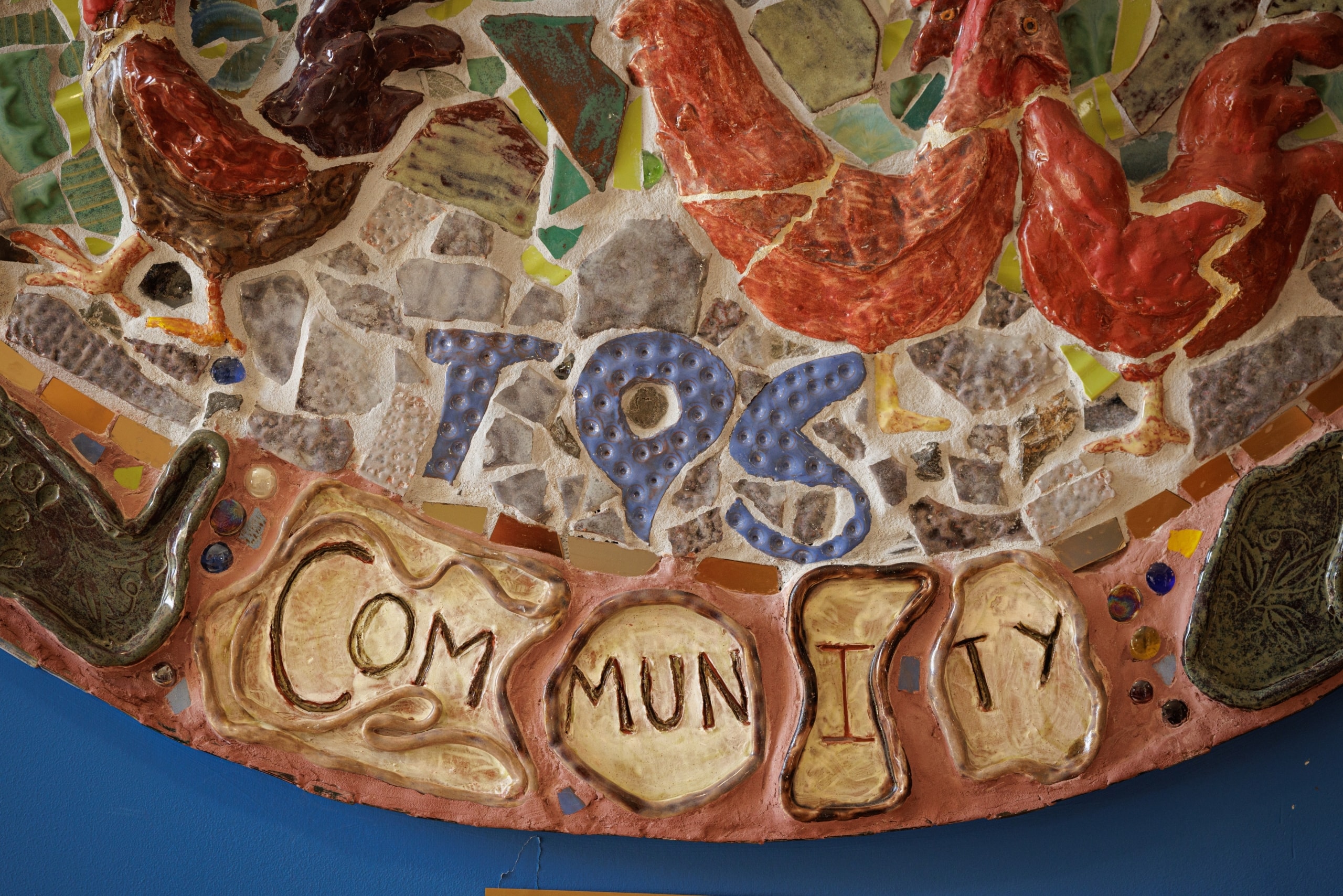 TQS mosaic reading "Community"