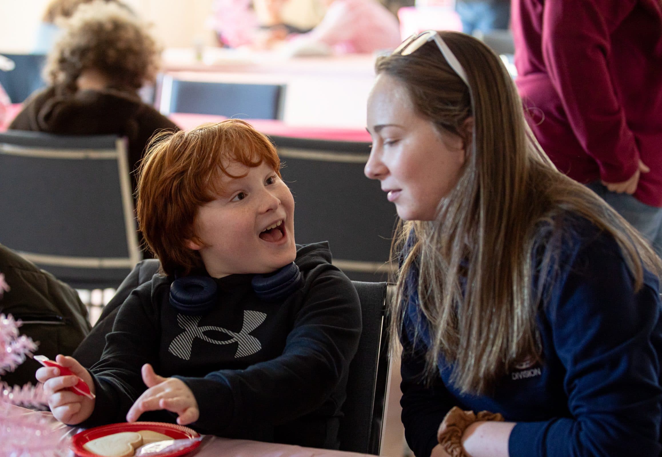 Student and staff member reacting excitedly during an activity