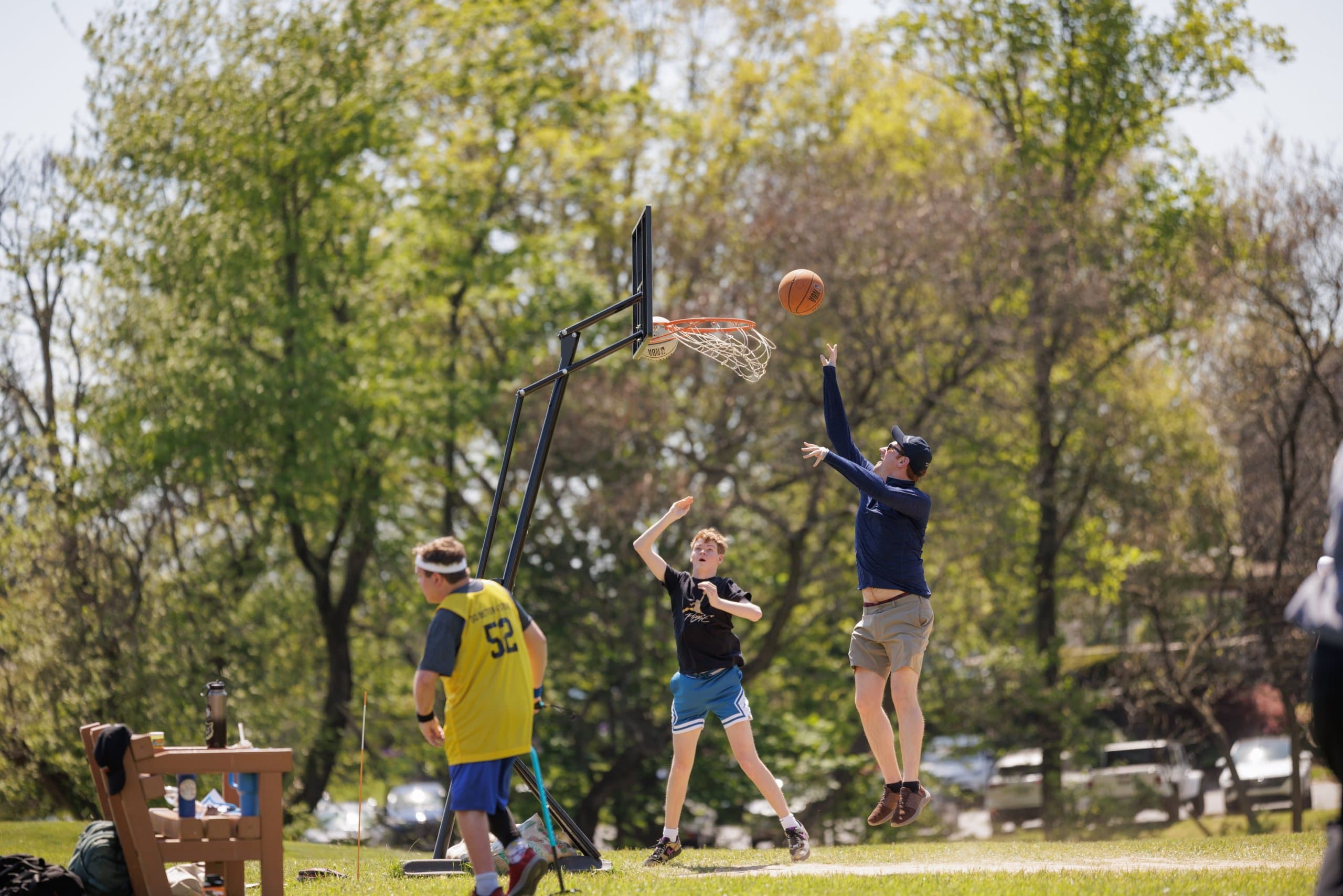 Students playing basketball outdoors