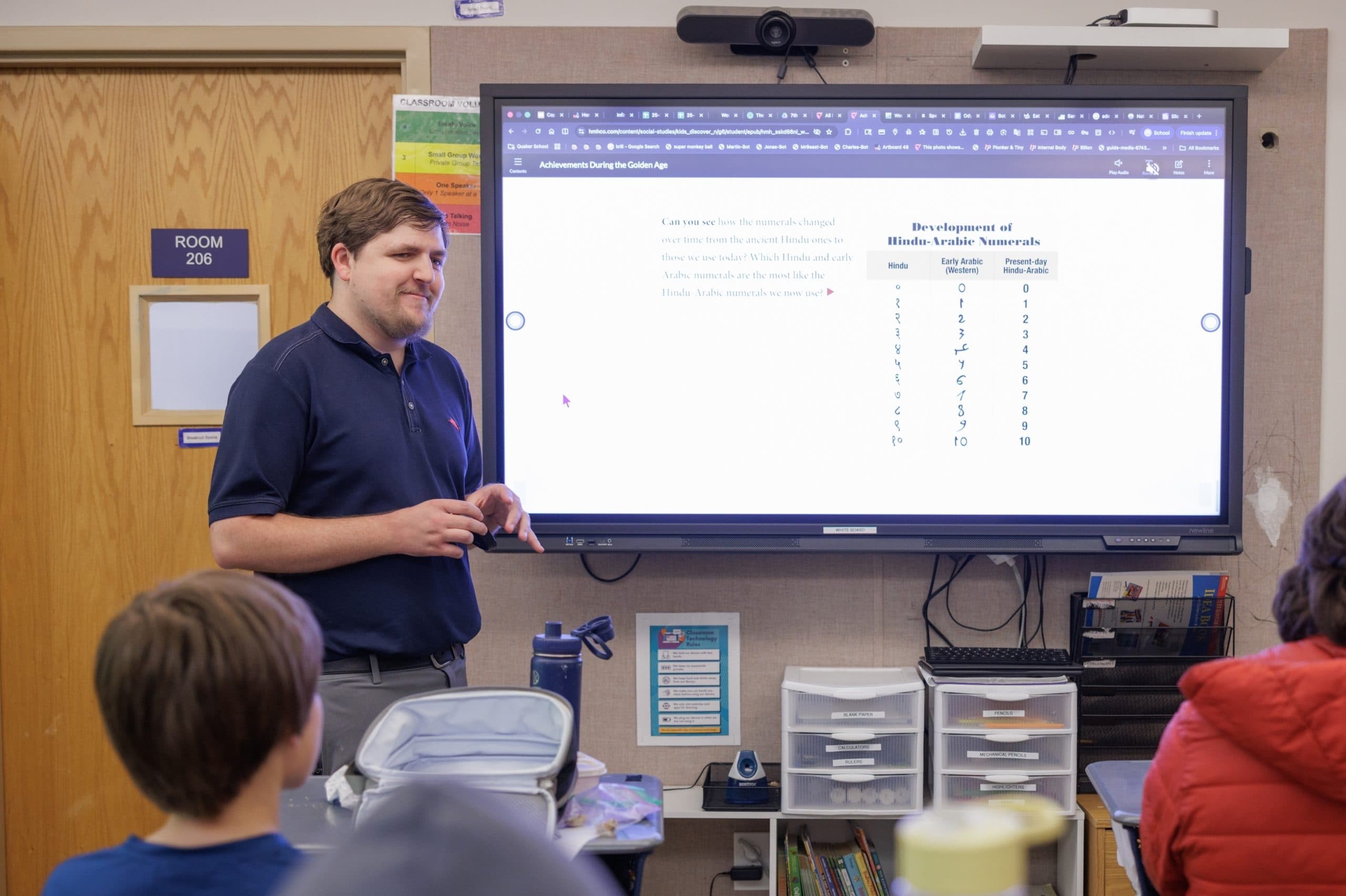 Staff member reviewing data during a presentation