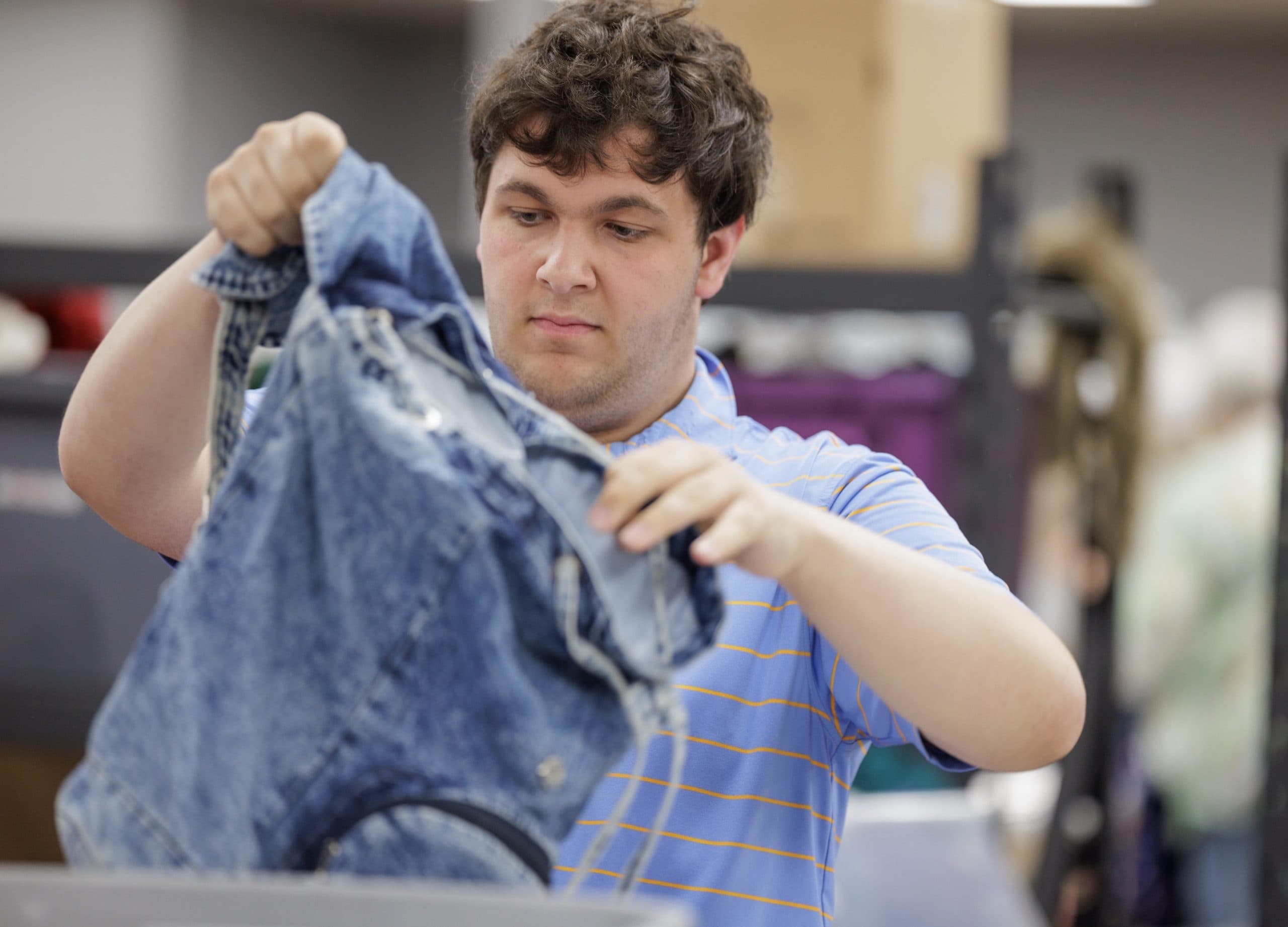 Student sorting donations at a community placement