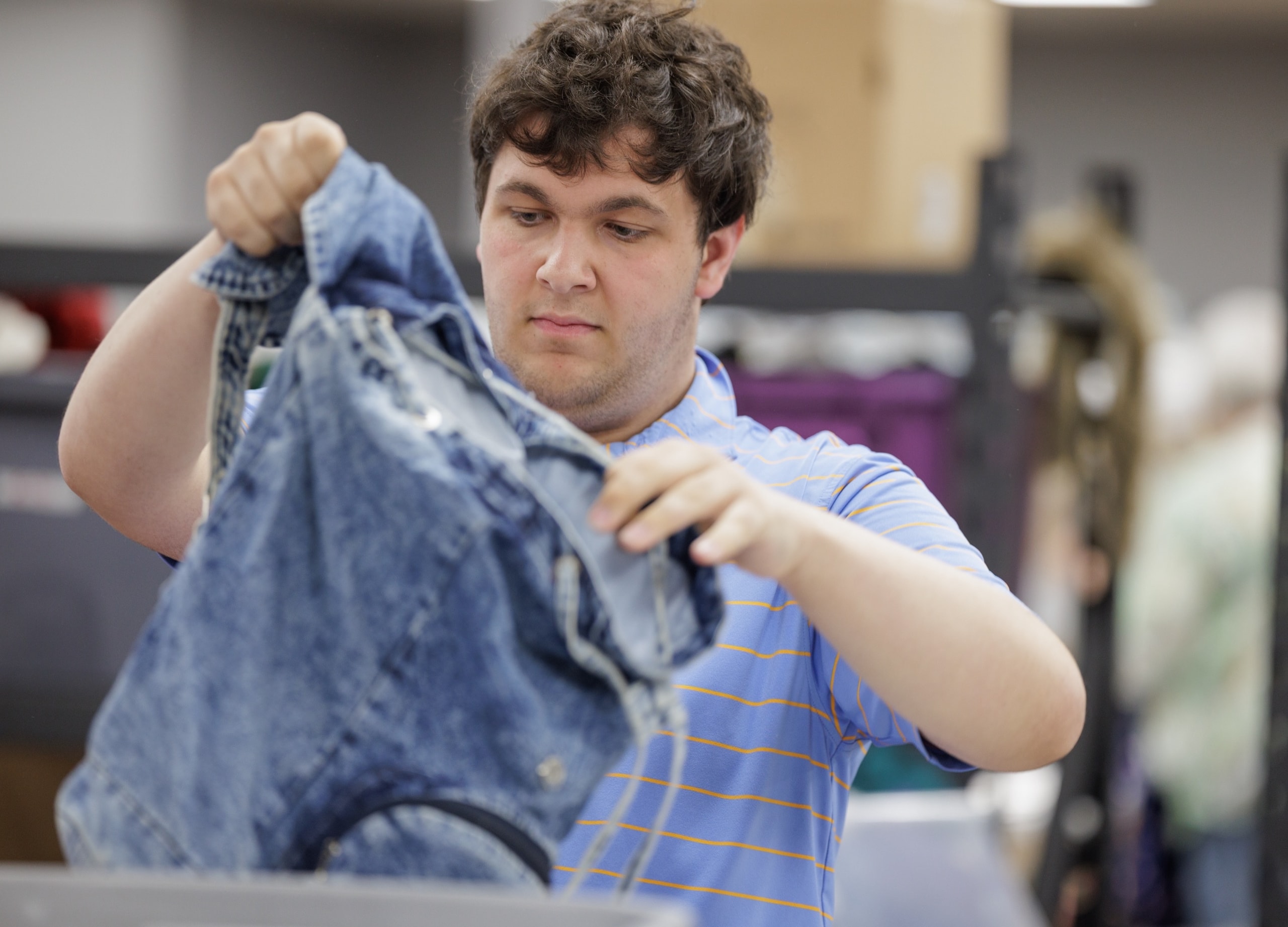 Student sorting donations at a community placement
