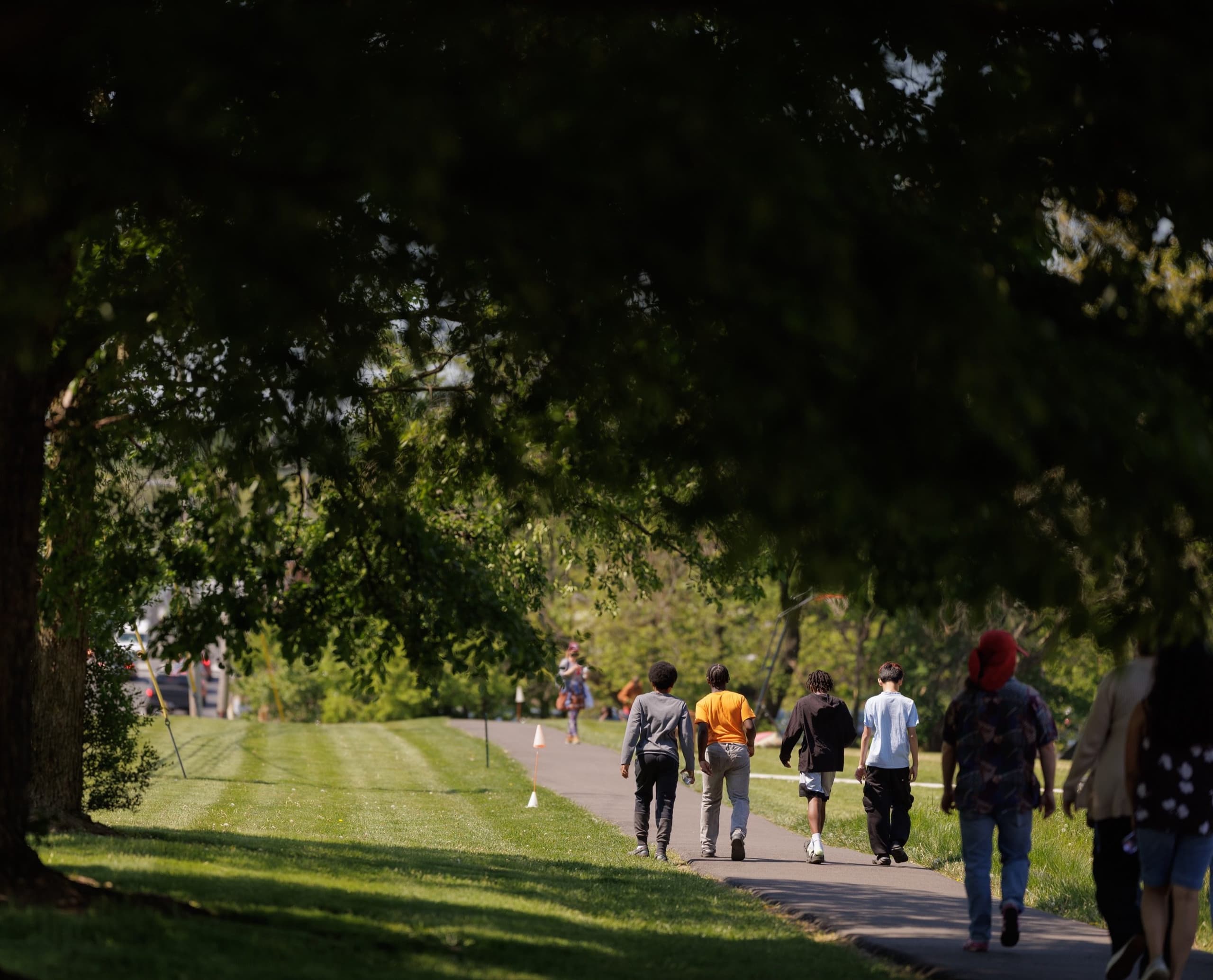 Students walking along a campus trail